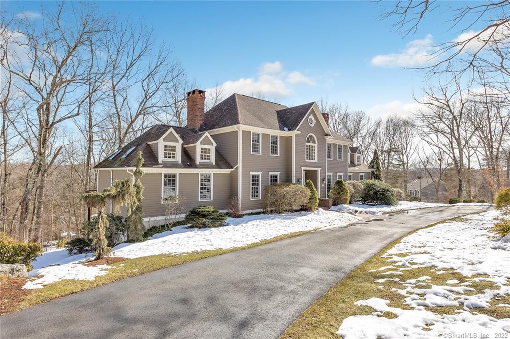 30 Wintergreen Road Monroe, CT 06468 - Photo 1 of 1 a view of a white house with a yard covered in snow