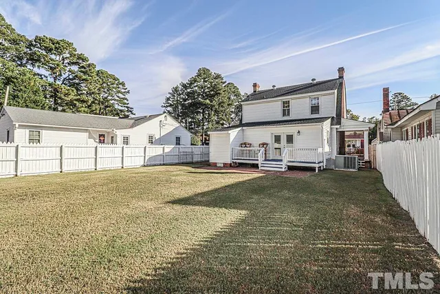 a house with trees in front of it