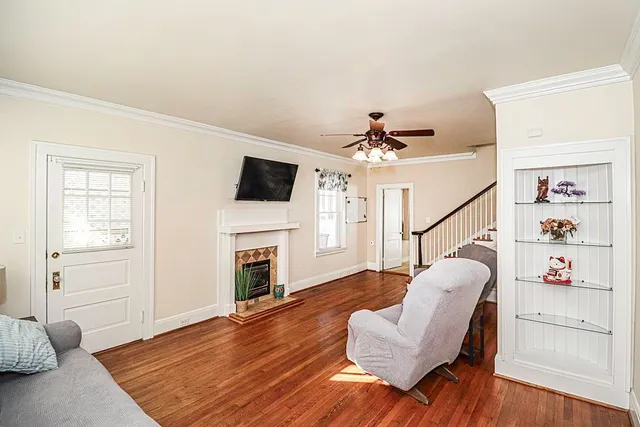 a living room with furniture and a fireplace
