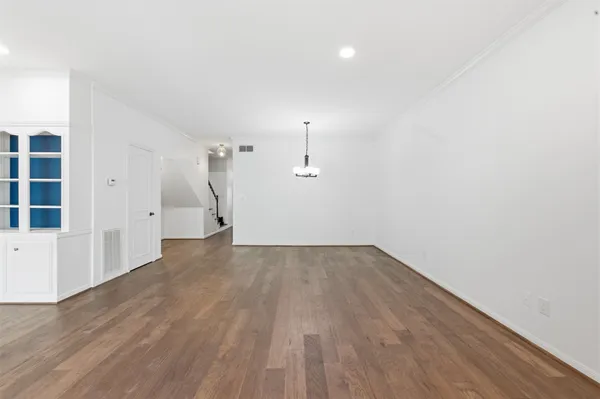 a backyard of a house with plants and outdoor seating