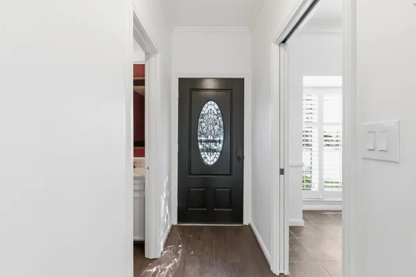 a kitchen with a sink a refrigerator and cabinets