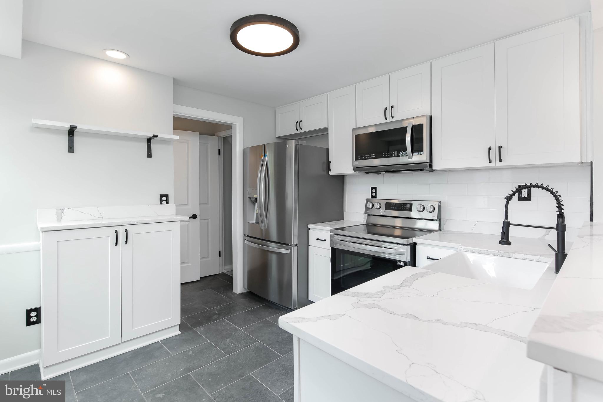 531 Anneslie Road Baltimore, MD 21212 - Photo 3 of 39 Renovated kitchen with quartz countertops
