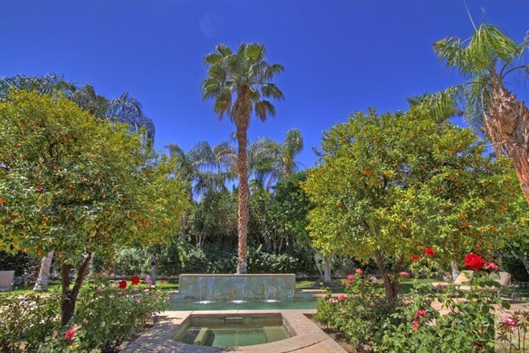 70570 Boothill Road Rancho Mirage, CA 92270 - Photo 2 of 35 a view of a yard with a fountain
