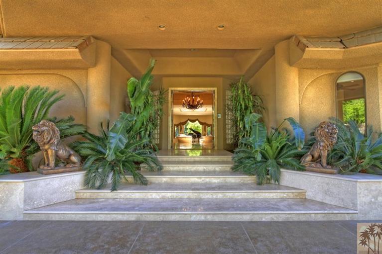 70570 Boothill Road Rancho Mirage, CA 92270 - Photo 5 of 35 a front view of a house with a yard