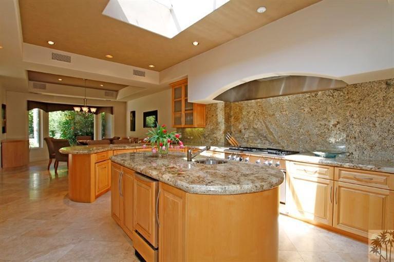 70570 Boothill Road Rancho Mirage, CA 92270 - Photo 10 of 35 a kitchen with stainless steel appliances granite countertop a sink and cabinets