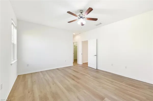 a view of a hallway with white walls