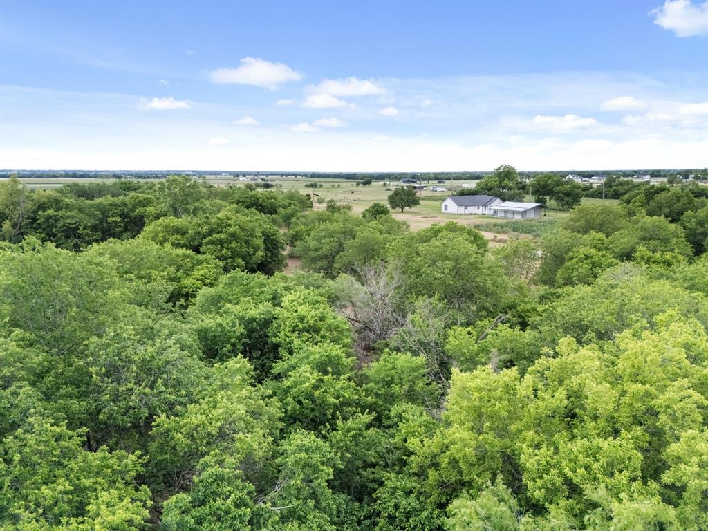 300 Grellhesl Road West, TX 76691 - Photo 32 of 35 an aerial view of residential houses with outdoor space and trees