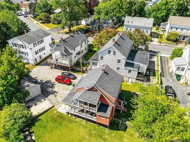 an aerial view of residential house with swimming pool and outdoor space