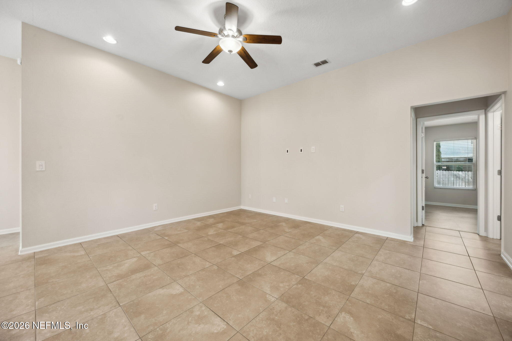 1602 Indigo Street Fernandina Beach, FL 32034 - Photo 18 of 35 an empty room with closet and a chandelier fan