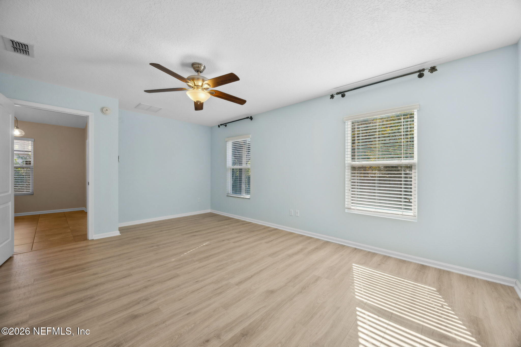 1602 Indigo Street Fernandina Beach, FL 32034 - Photo 20 of 35 a view of empty room with wooden floor and fan
