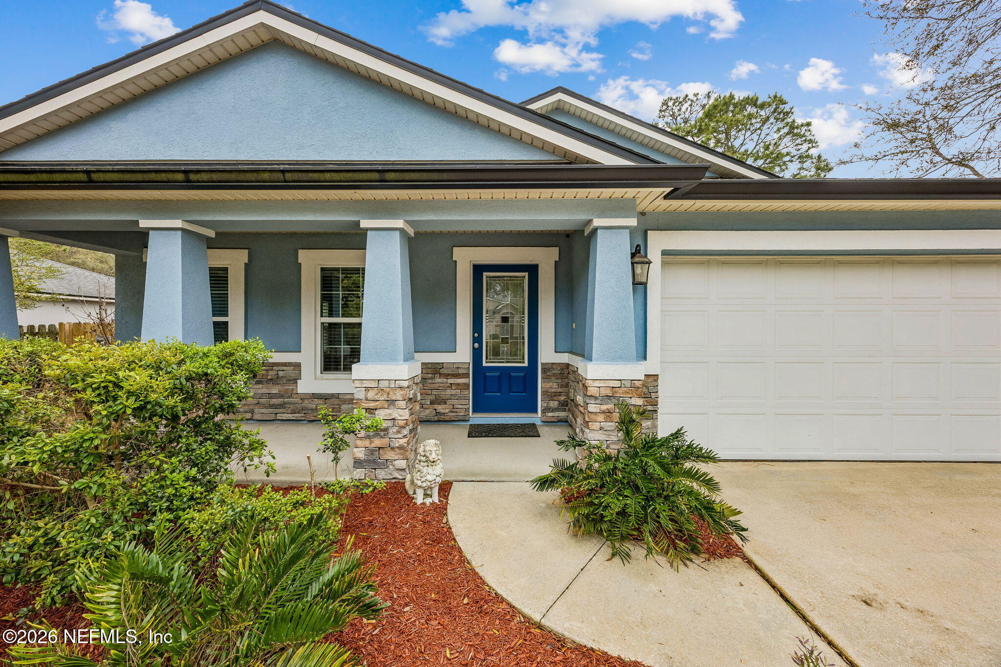 1602 Indigo Street Fernandina Beach, FL 32034 - Photo 2 of 35 front view of house with potted plants