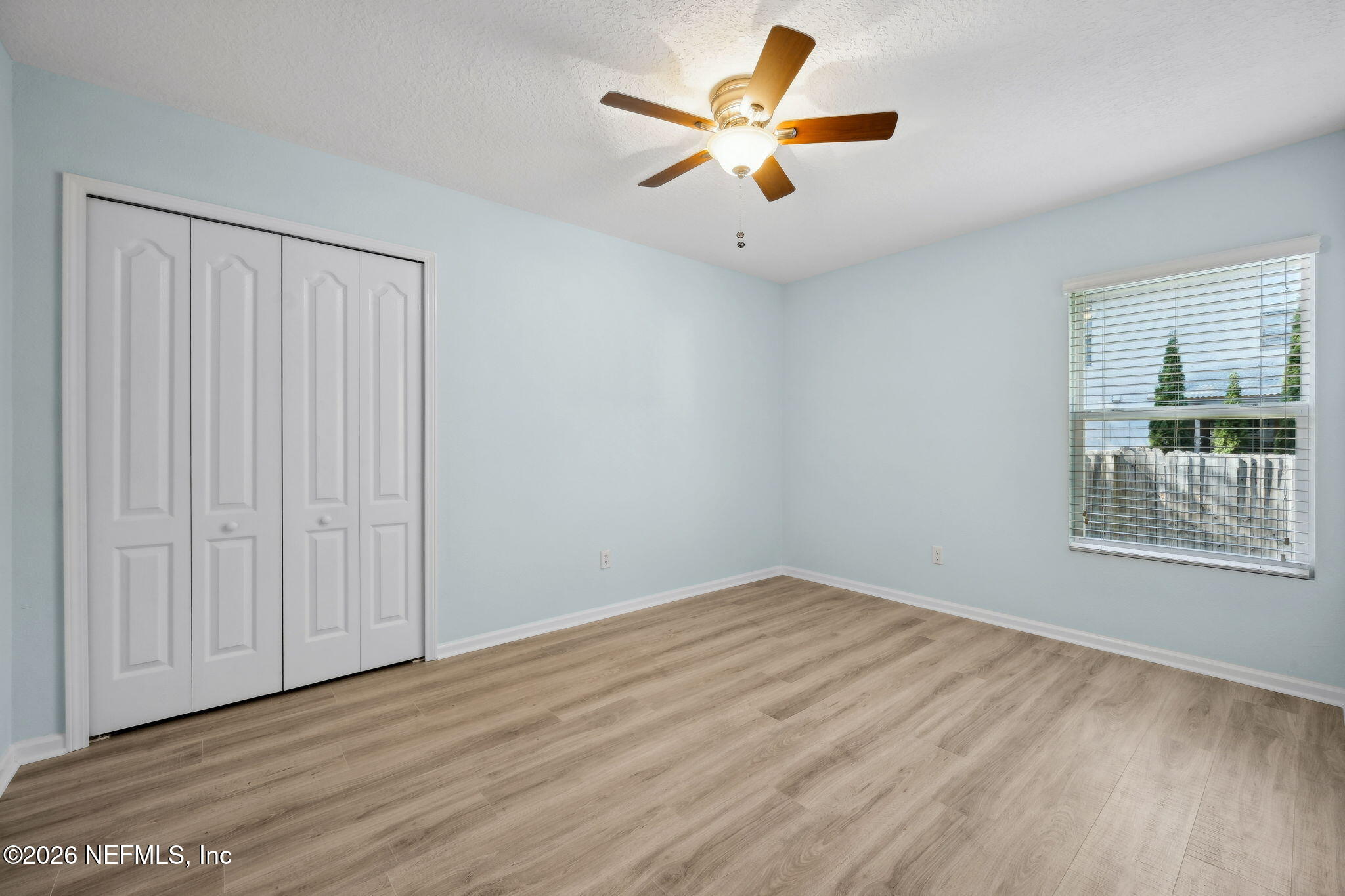 1602 Indigo Street Fernandina Beach, FL 32034 - Photo 25 of 35 an empty room with wooden floor and windows