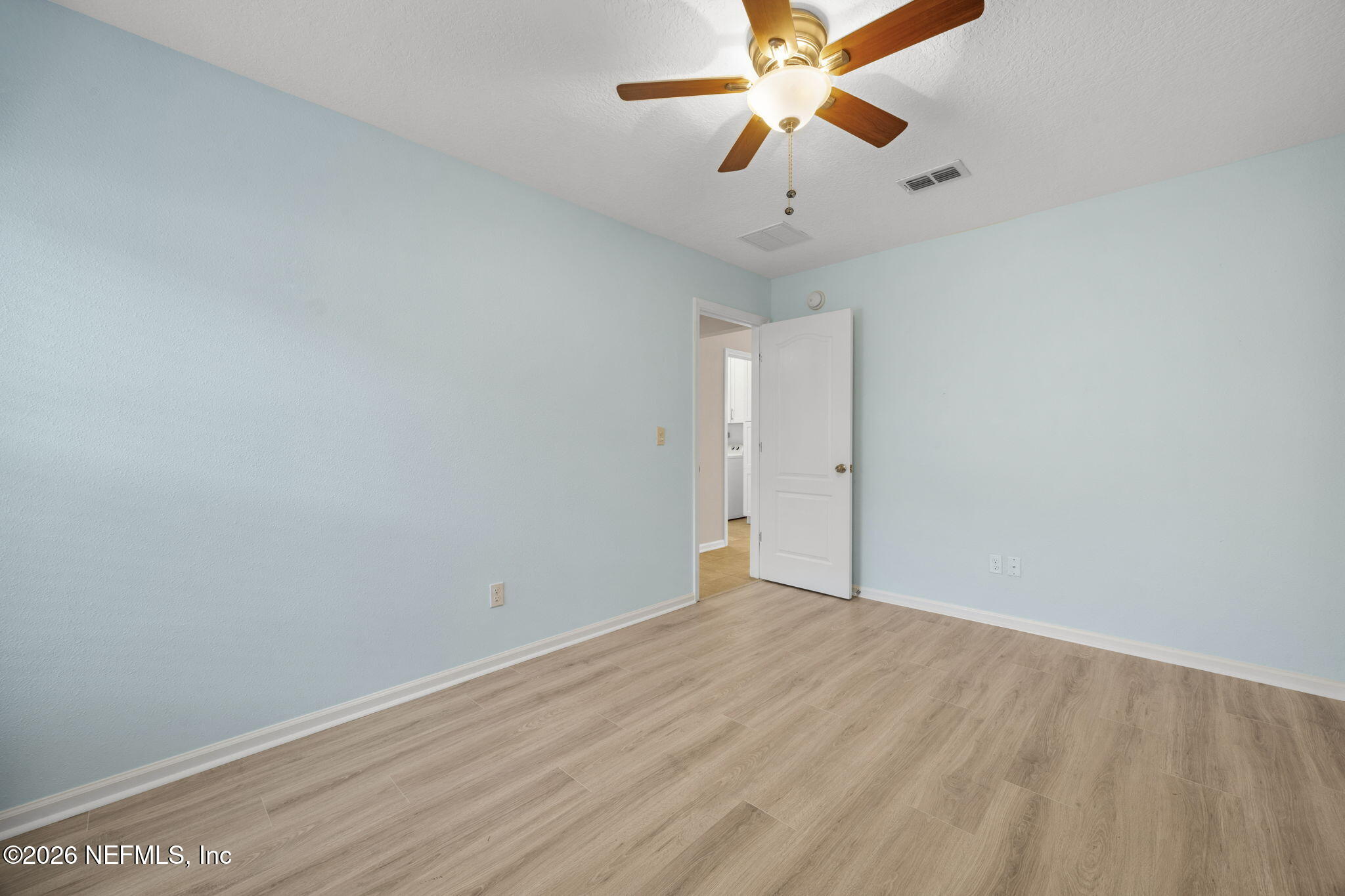 1602 Indigo Street Fernandina Beach, FL 32034 - Photo 26 of 35 an empty room with windows and fan