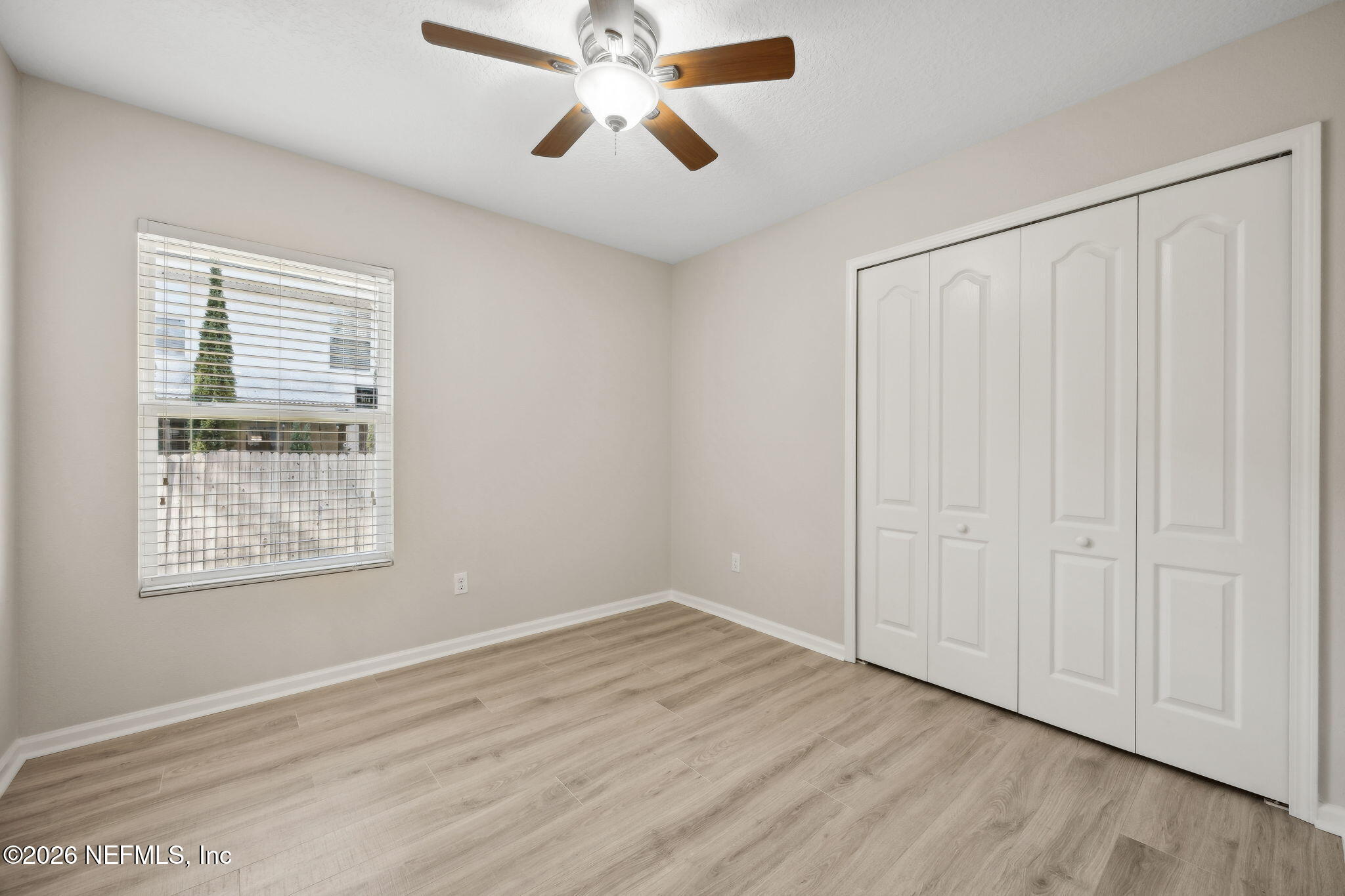1602 Indigo Street Fernandina Beach, FL 32034 - Photo 28 of 35 a view of an empty room with wooden floor and a window
