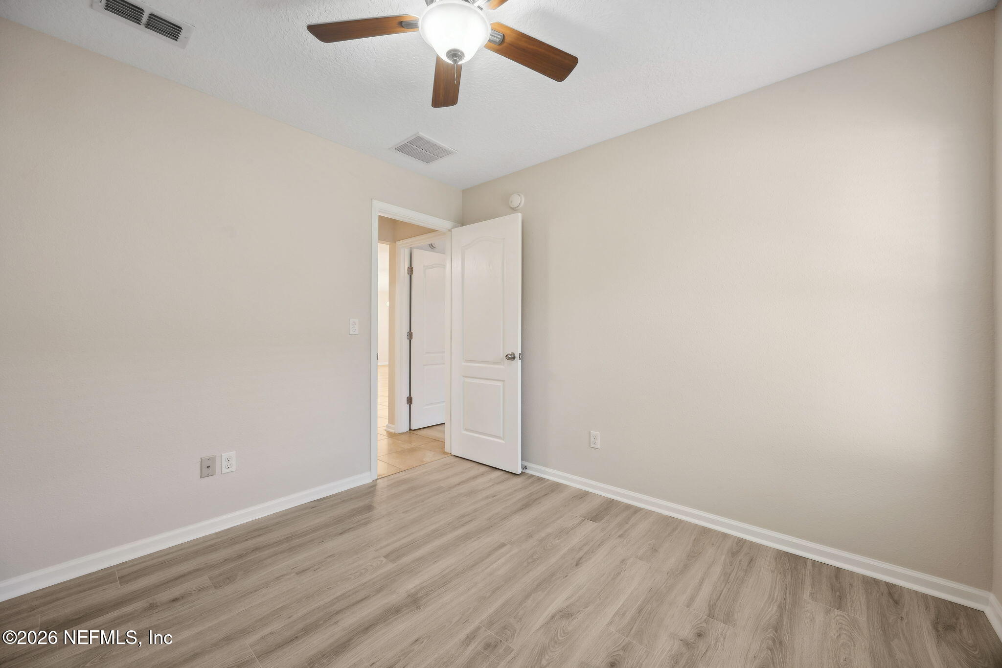 1602 Indigo Street Fernandina Beach, FL 32034 - Photo 29 of 35 an empty room with a empty space and a ceiling fan