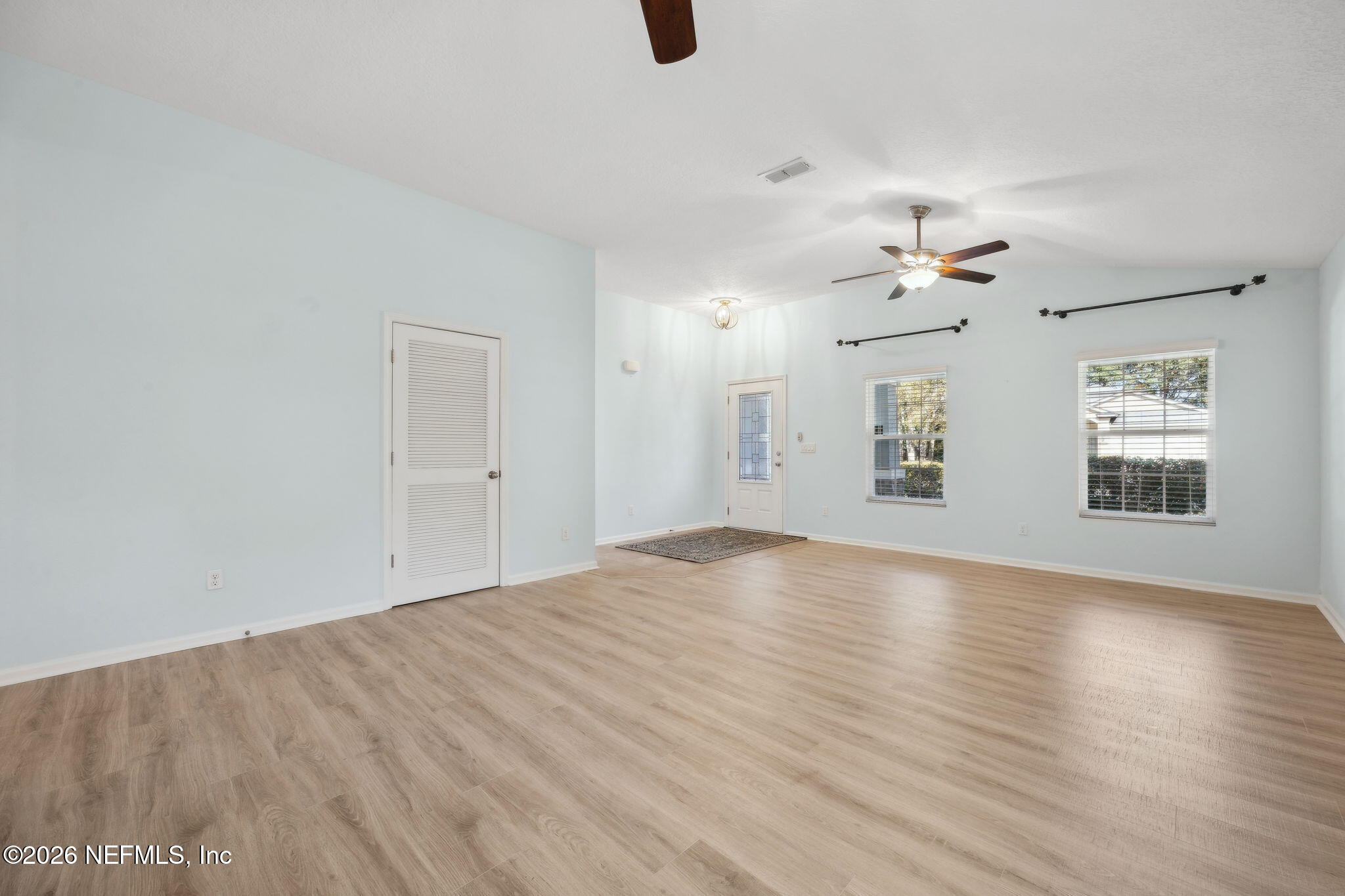 1602 Indigo Street Fernandina Beach, FL 32034 - Photo 6 of 35 wooden floor in an empty room with a window