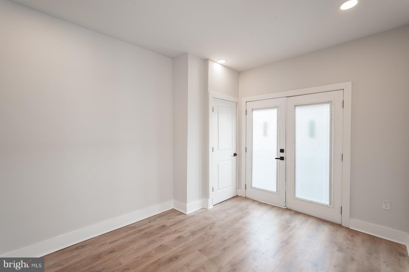 5111 Willows Avenue, Unit B Philadelphia, PA 19143 - Photo 13 of 18 a view of an empty room and wooden floor