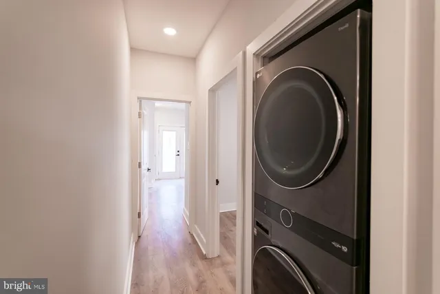 a view of a hallway with washer and dryer