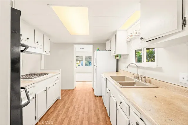 a view of a livingroom with a ceiling fan and window