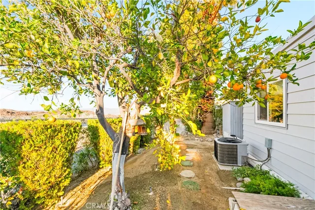 a living room with lots of furniture and a view of dining room