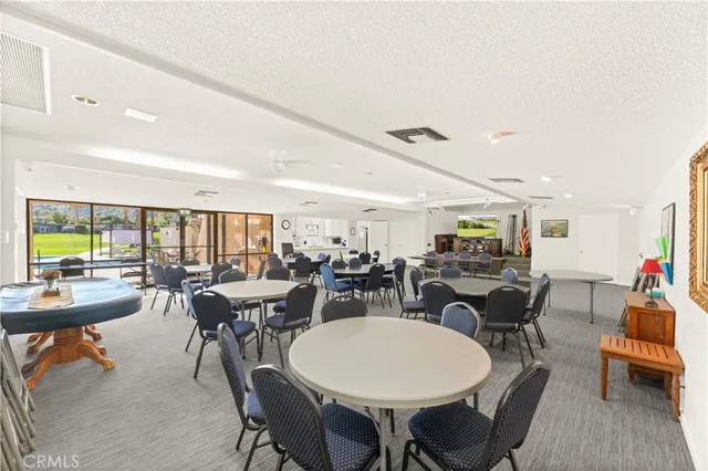 a very nice looking room with a large window and a wooden floor