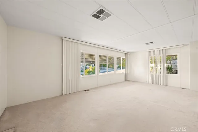 a kitchen with a sink a stove and cabinets