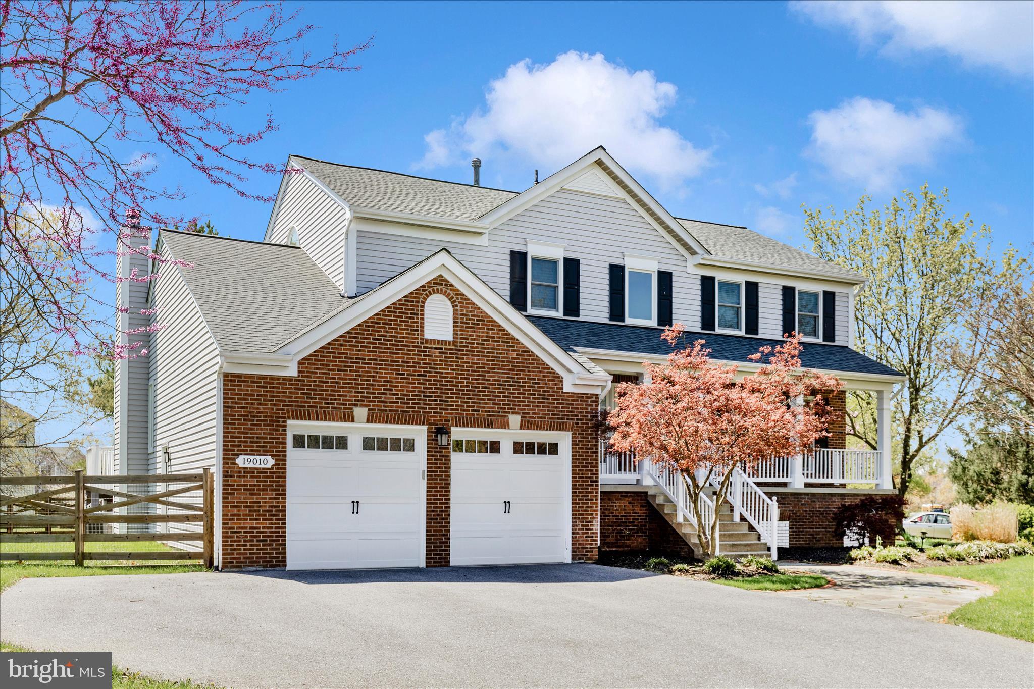 19010 Wootton Avenue Poolesville, MD 20837 - Photo 1 of 51 a front view of a house with a garage
