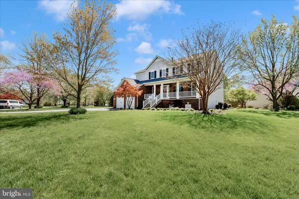 a front view of a building with a garden