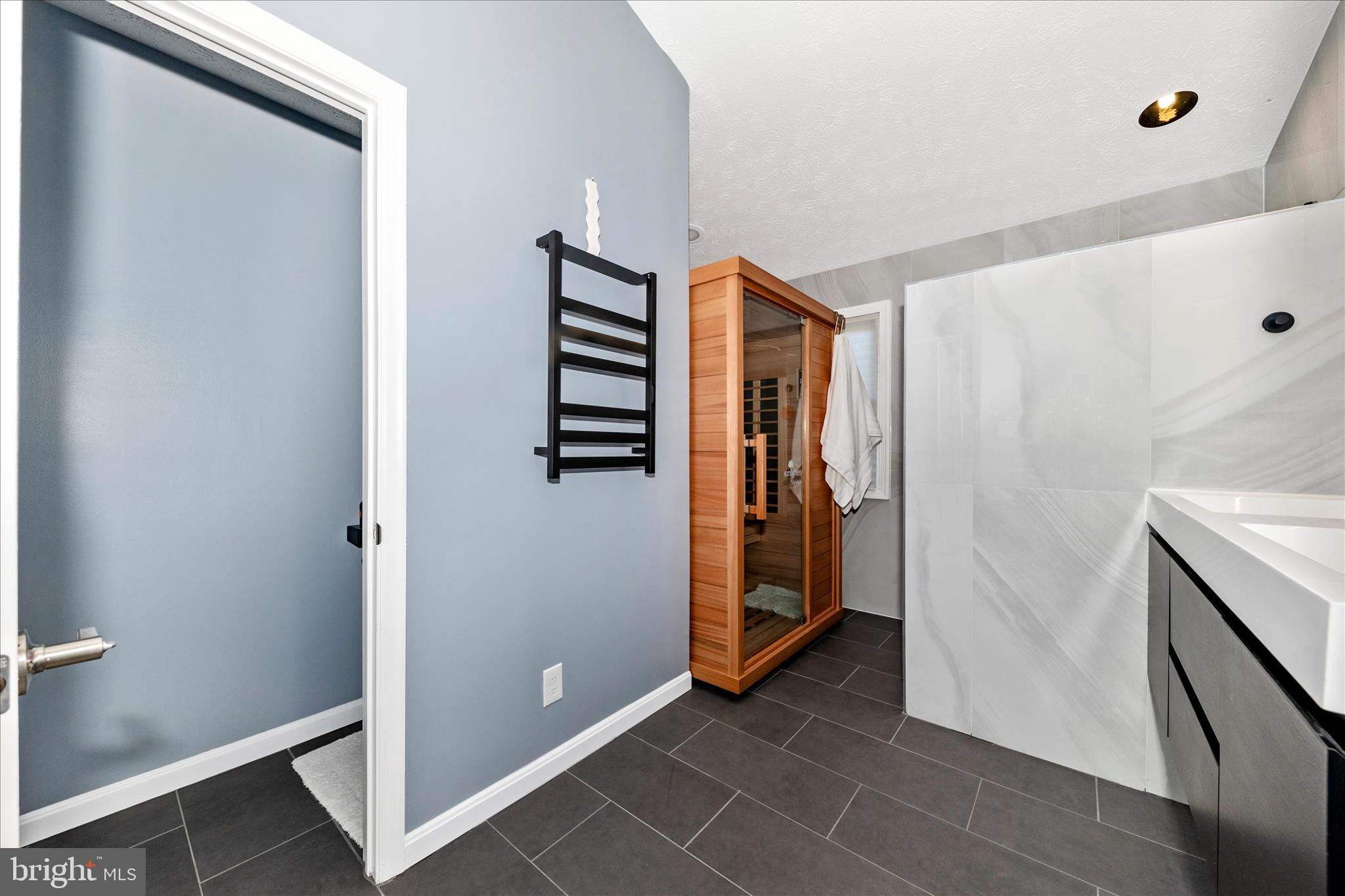 19010 Wootton Avenue Poolesville, MD 20837 - Photo 21 of 51 a view of walk in closet with clothes