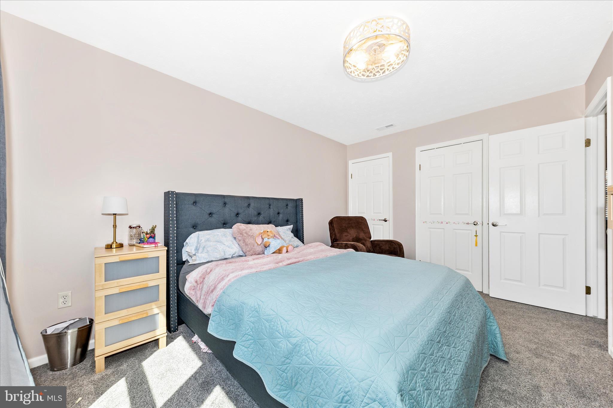 19010 Wootton Avenue Poolesville, MD 20837 - Photo 27 of 51 a bedroom with a bed and a window