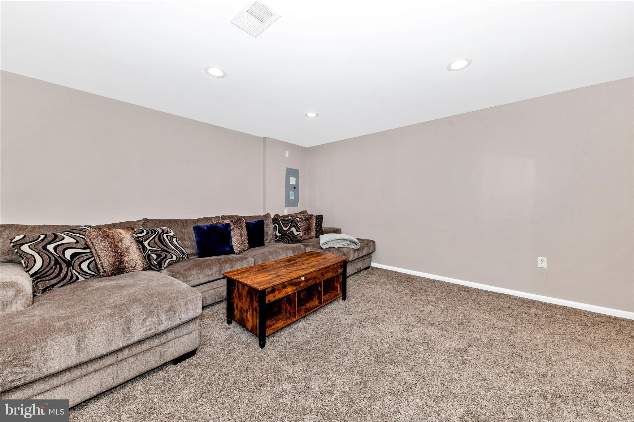 19010 Wootton Avenue Poolesville, MD 20837 - Photo 32 of 51 a living room with furniture and a couch