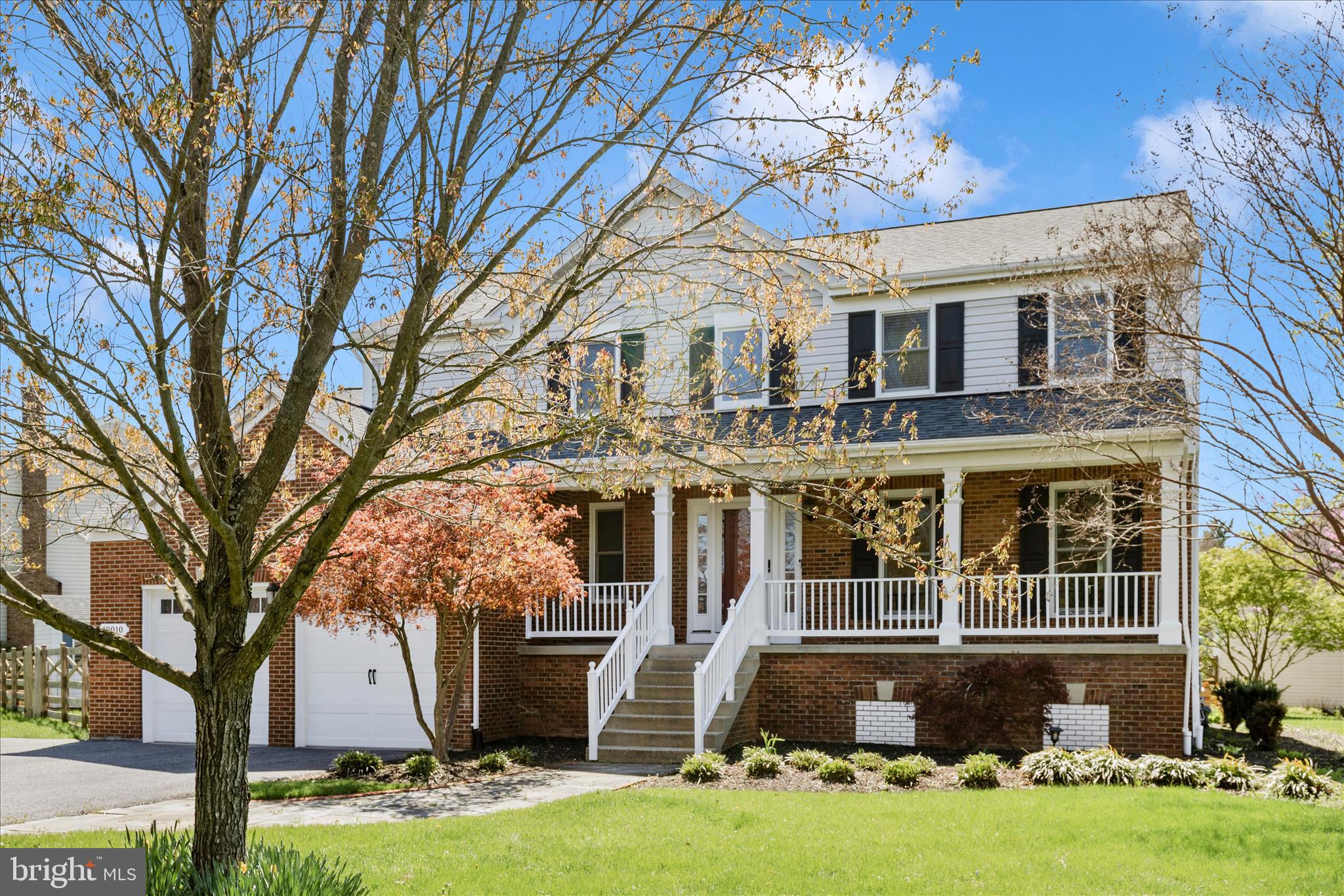 19010 Wootton Avenue Poolesville, MD 20837 - Photo 37 of 51 a front view of a house with garden