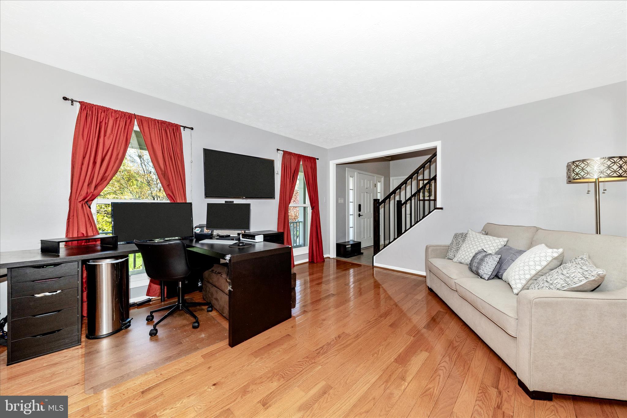 19010 Wootton Avenue Poolesville, MD 20837 - Photo 4 of 51 a living room with furniture rug and a window