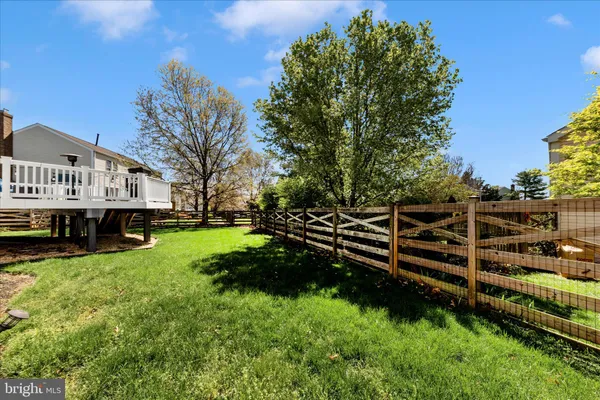 a view of house with yard