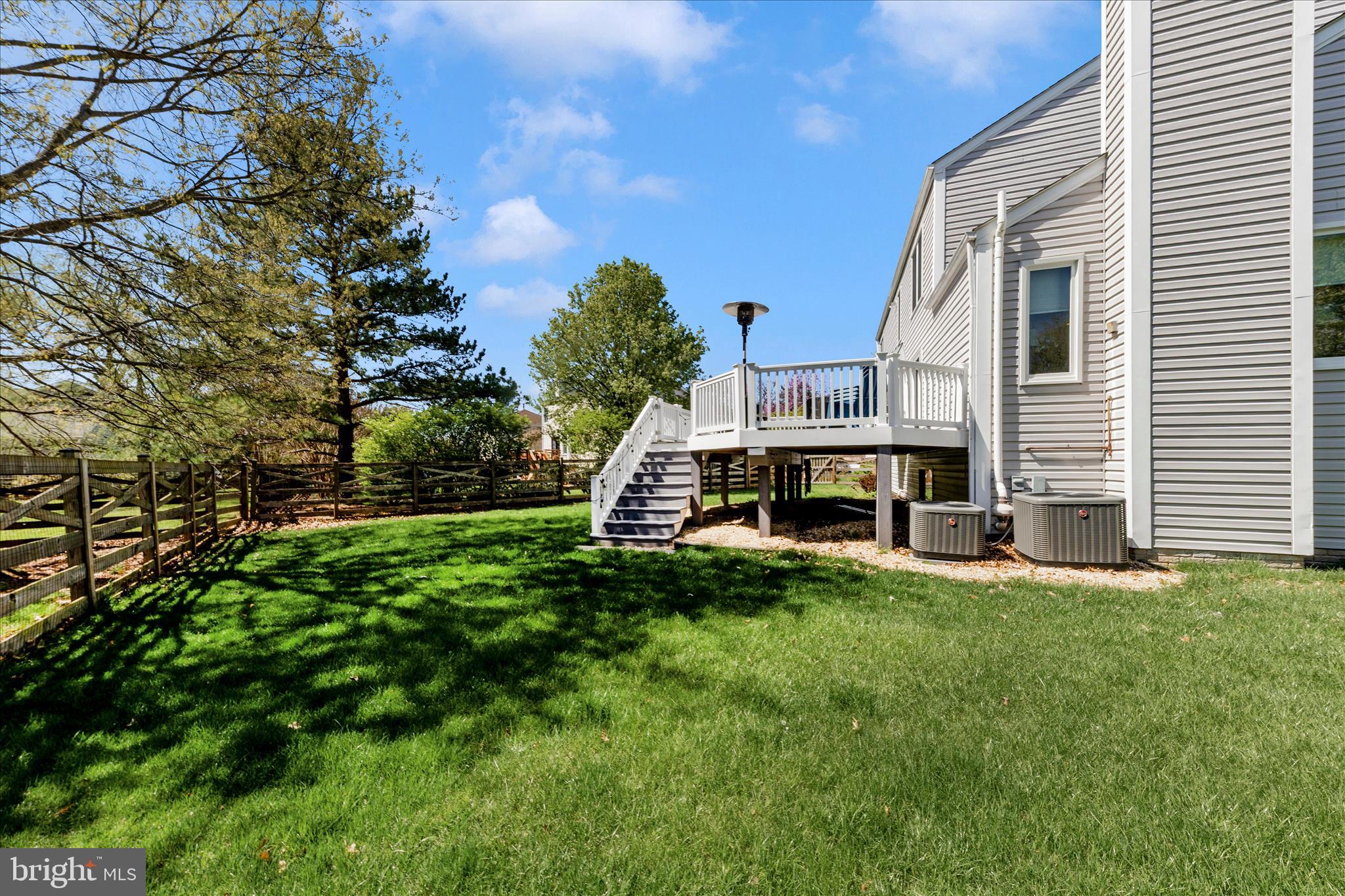19010 Wootton Avenue Poolesville, MD 20837 - Photo 42 of 51 a view of a house with a backyard