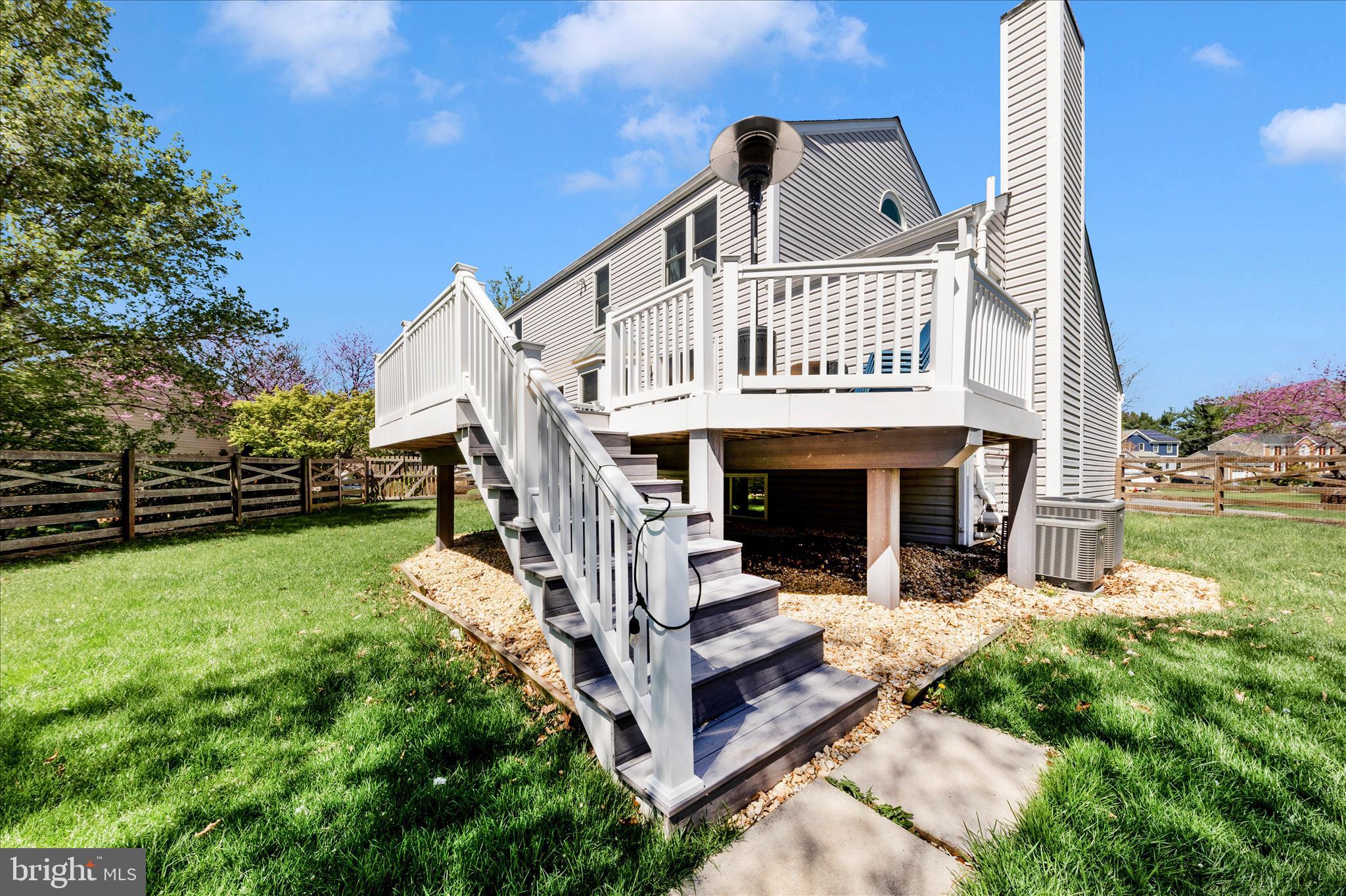 19010 Wootton Avenue Poolesville, MD 20837 - Photo 43 of 51 a view of a house with a yard porch and sitting area