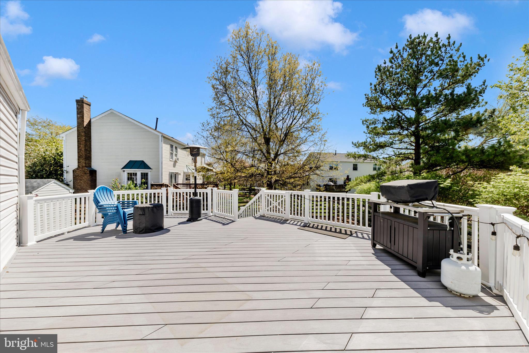 19010 Wootton Avenue Poolesville, MD 20837 - Photo 44 of 51 a view of a deck with couches under an umbrella