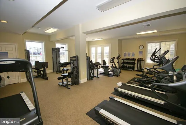 a room with lots of furniture and a wooden floor