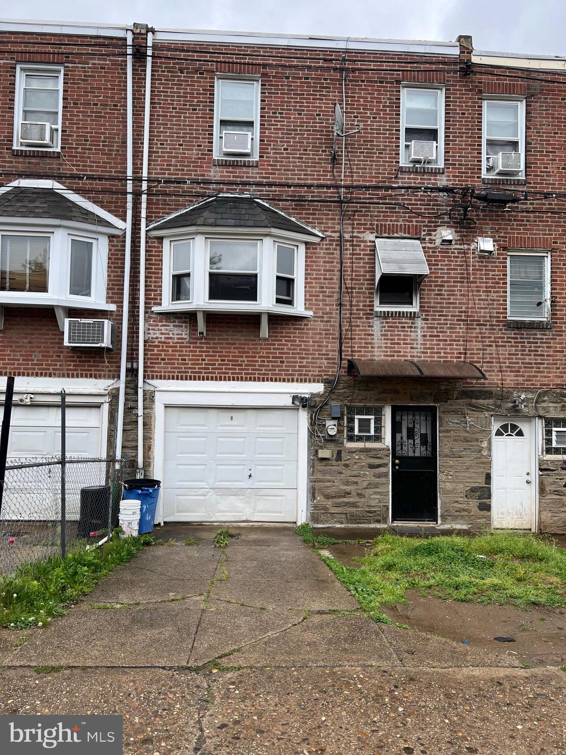 6834 Large Street Philadelphia, PA 19149 - Photo 2 of 4 a front view of a house with a garden