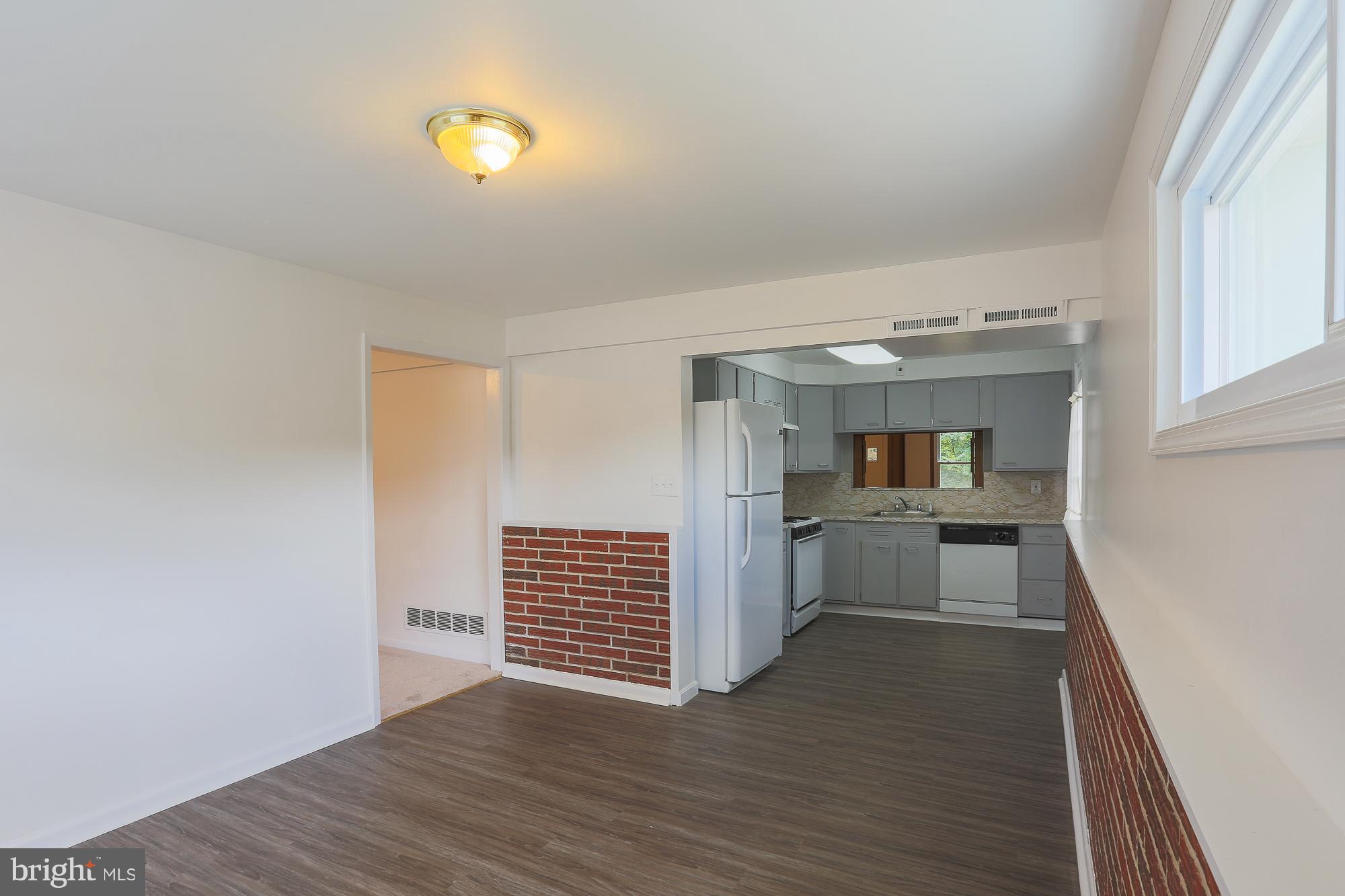 5625 Huntsmoor Road Baltimore, MD 21227 - Photo 11 of 30 a view of kitchen and wooden floor