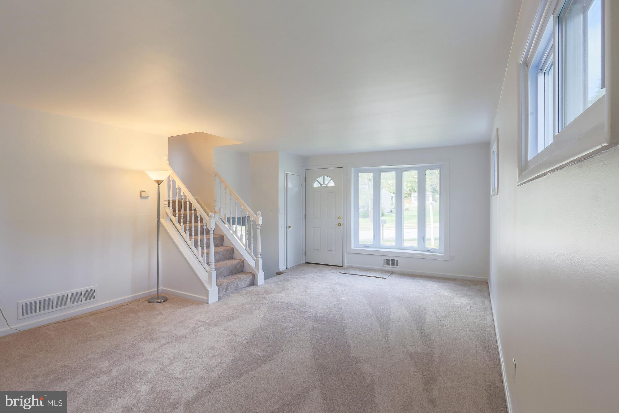 5625 Huntsmoor Road Baltimore, MD 21227 - Photo 3 of 30 a view of an empty room with stairs