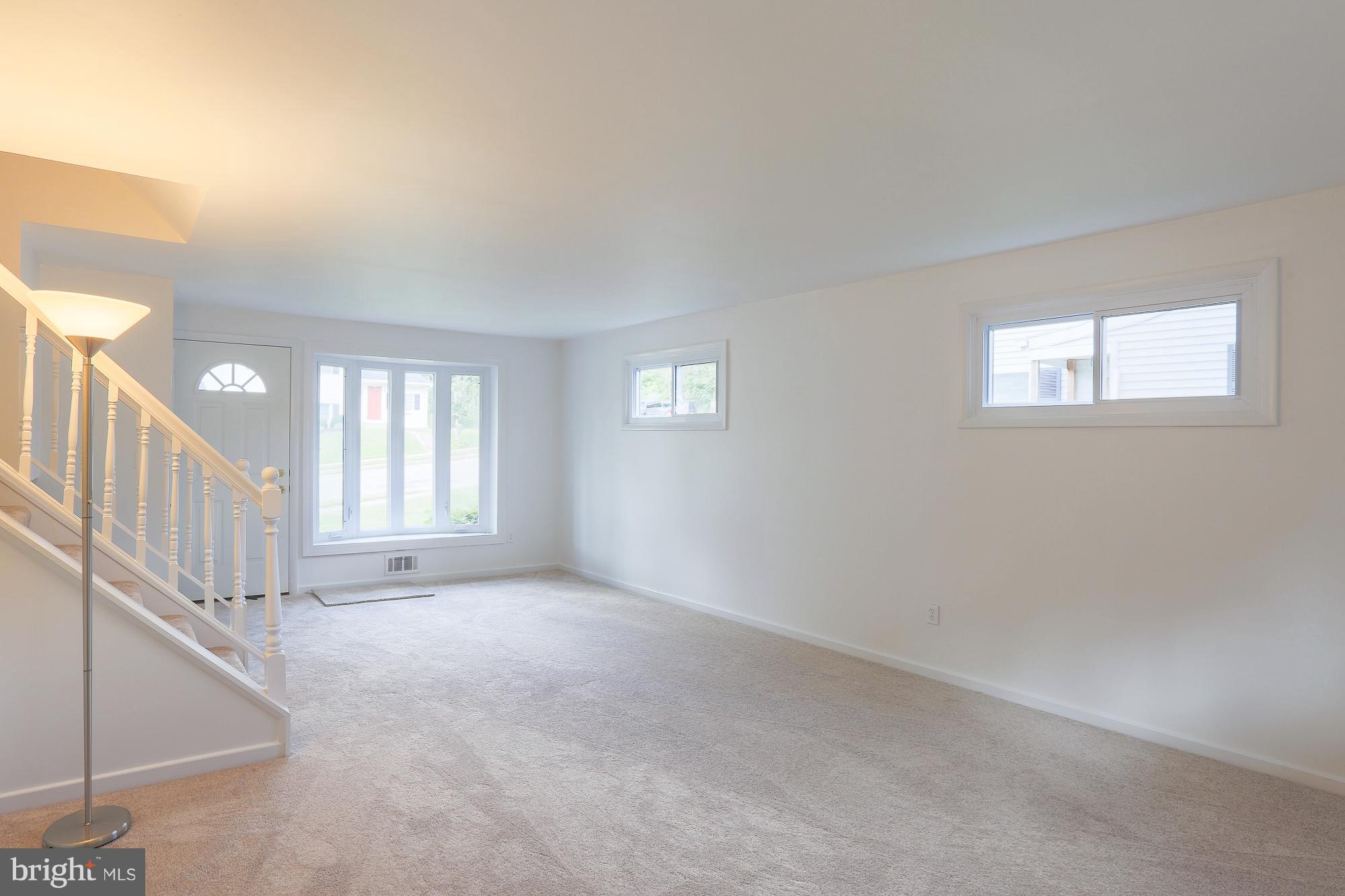 5625 Huntsmoor Road Baltimore, MD 21227 - Photo 5 of 30 a view of an empty room with a window