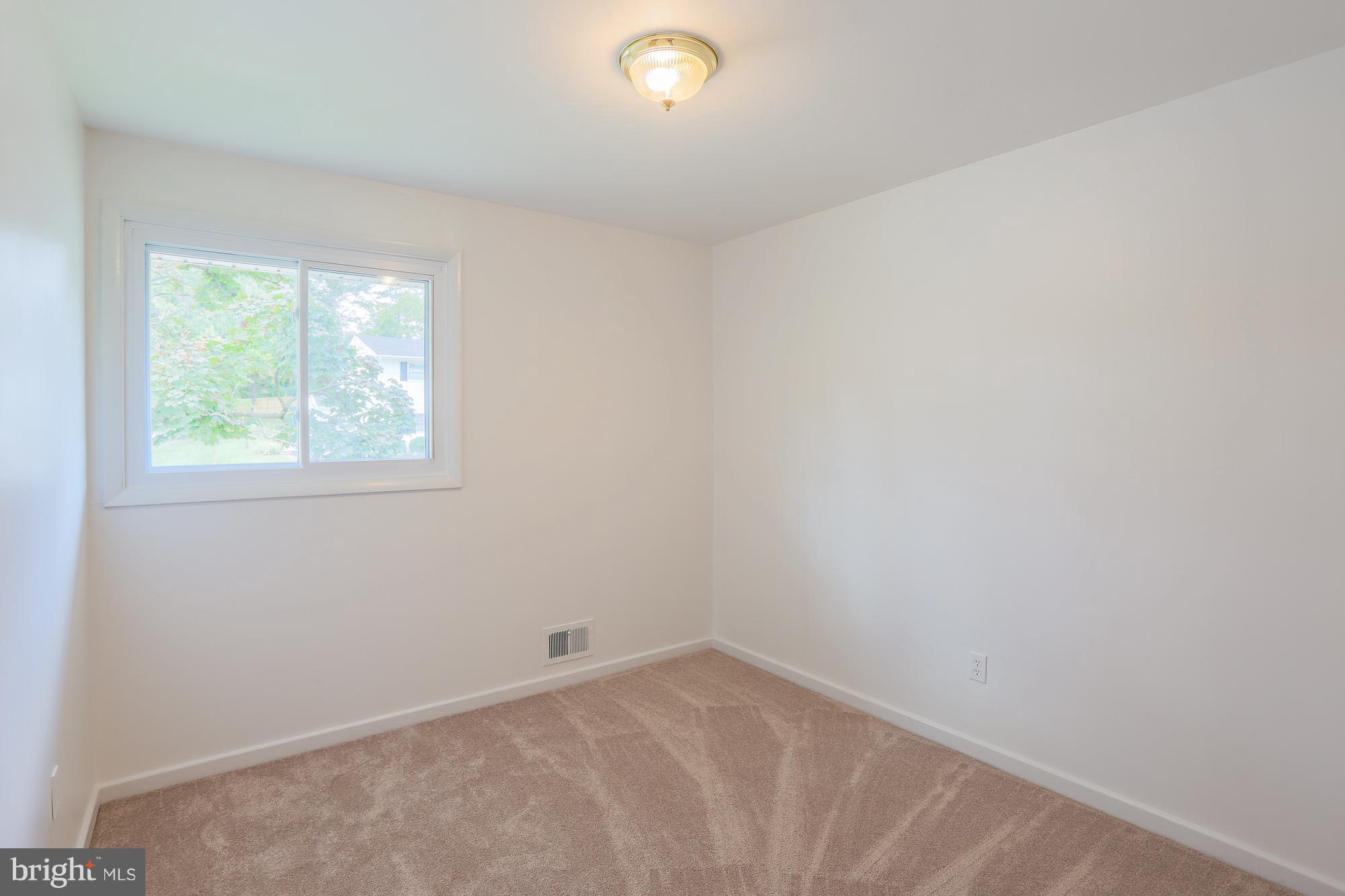 5625 Huntsmoor Road Baltimore, MD 21227 - Photo 8 of 30 an empty room with a window
