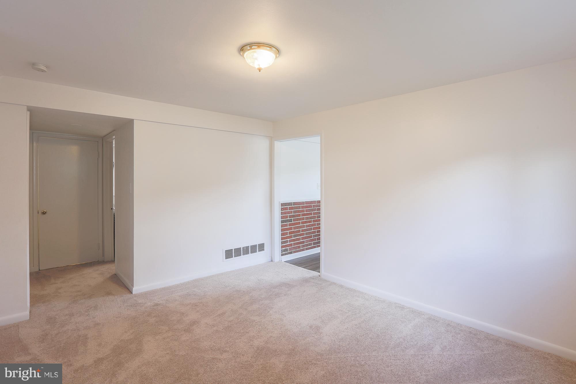 5625 Huntsmoor Road Baltimore, MD 21227 - Photo 10 of 30 a view of an empty room and a window
