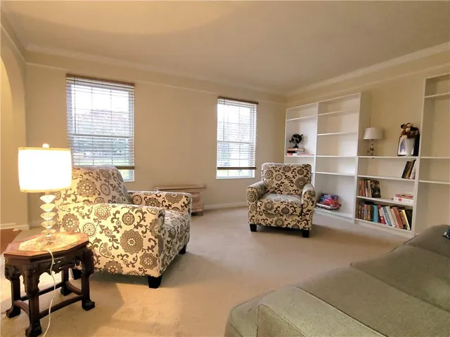 a bedroom with bed and a couch