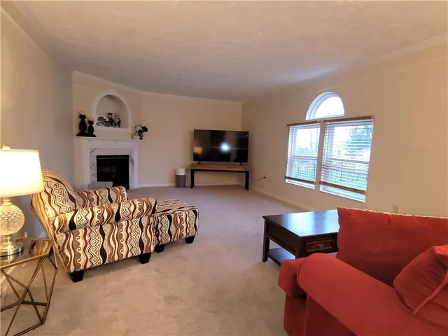 a bedroom with furniture and a fireplace