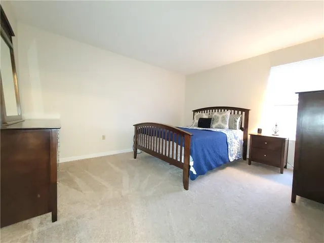 a bedroom with a bed and a cabinets
