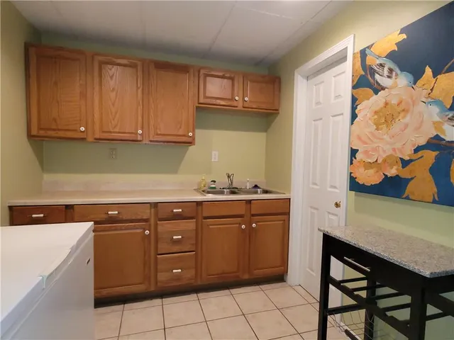 a kitchen with stainless steel appliances granite countertop a sink and cabinets