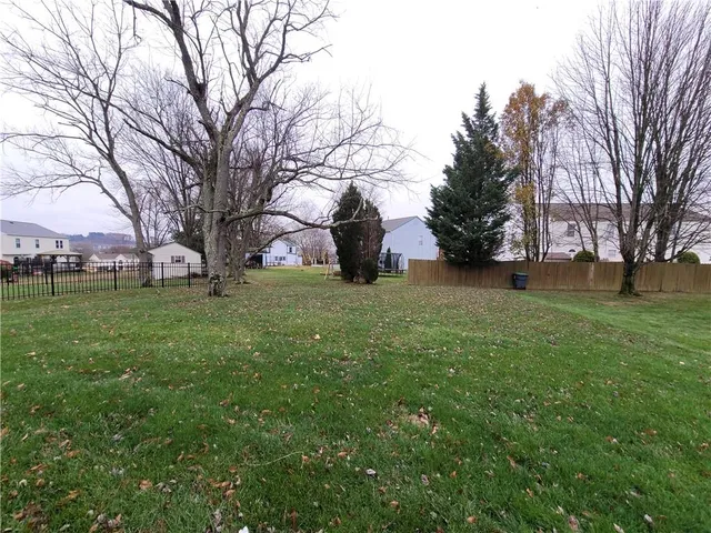 a view of a field with trees