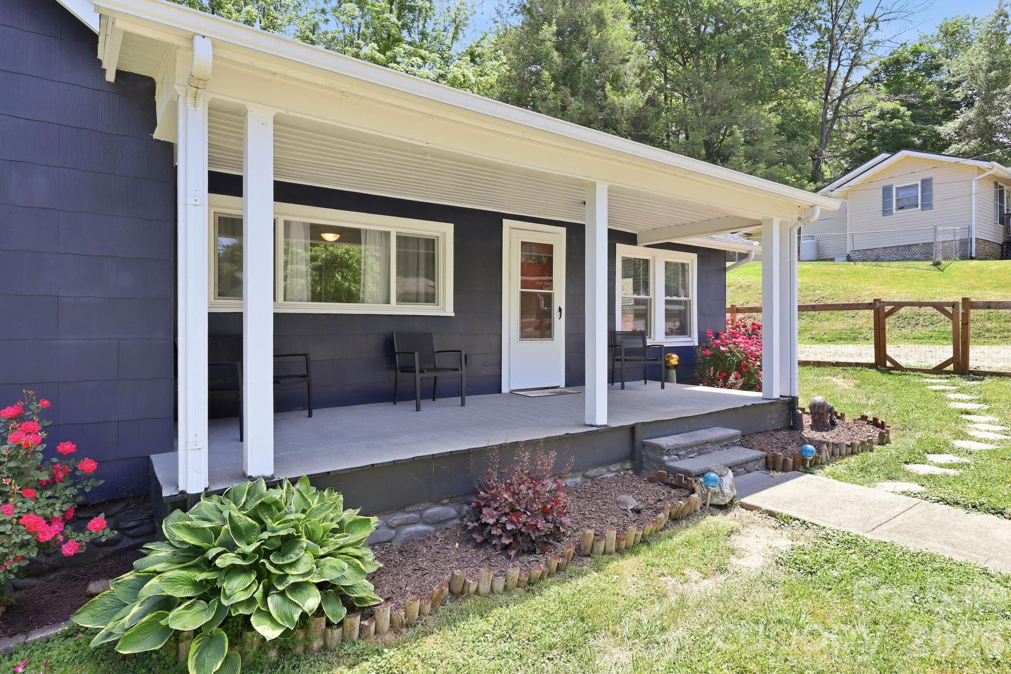 197 Mulberry Street Clyde, NC 28721 - Photo 2 of 31 a view of a house with garden